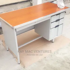 A Metal Table With Wooden Top