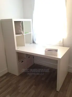 A Table and a Shelving Like Unit