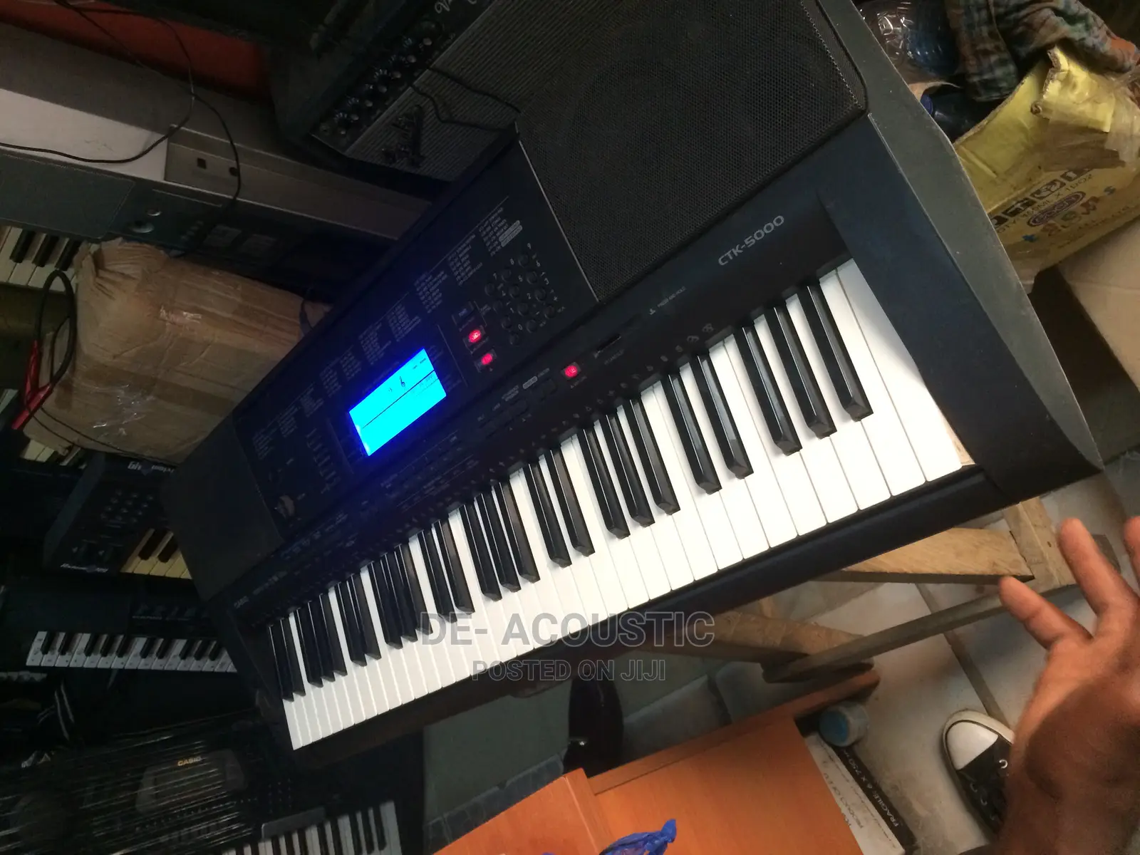 Featuring a 61 Key Piano Style Touch Sensitive Keyboard