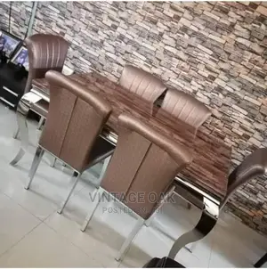 Exquisite Marble Dining Table With 6 Luxury Chairs in Brown.