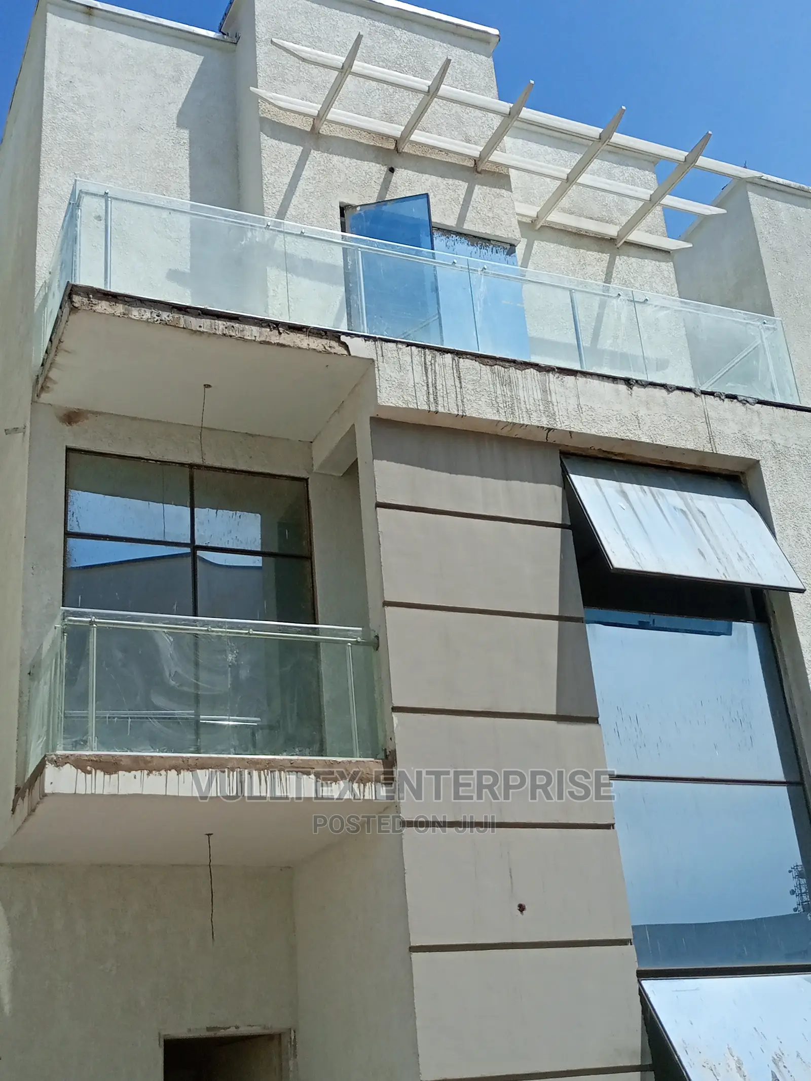 Reflective Glass Frameless Window
