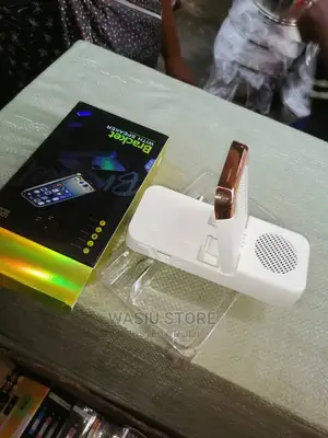 Mobile Phone Holder and Bluetooth Speaker With USB Ports