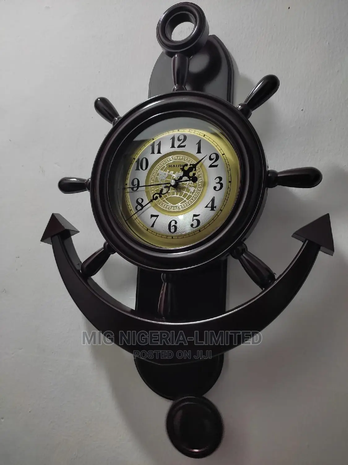 Graceful Plastic Pendulum Wall Clock for Home Decor.