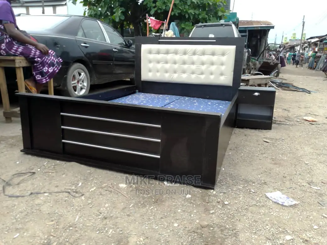 A Wooden 6ft by 6ft Bedframe With a Bedside Drawer