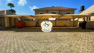 Carport for 6 Cars With Yellow Roofing