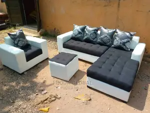 L-Shape Sofa With Single Chair and Ottoman Table.