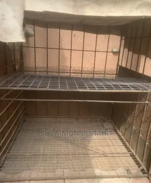 An Iron Rod Standard Cage For Rearing Of Dogs And Chicken.