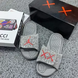 Original KAWS X JORDAN Retro Slides Available in Store