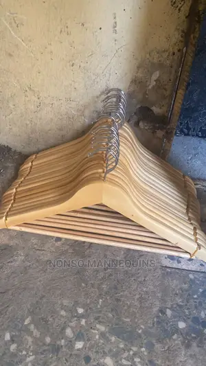 Bundles Of Wooden Hangers For Clothes Display