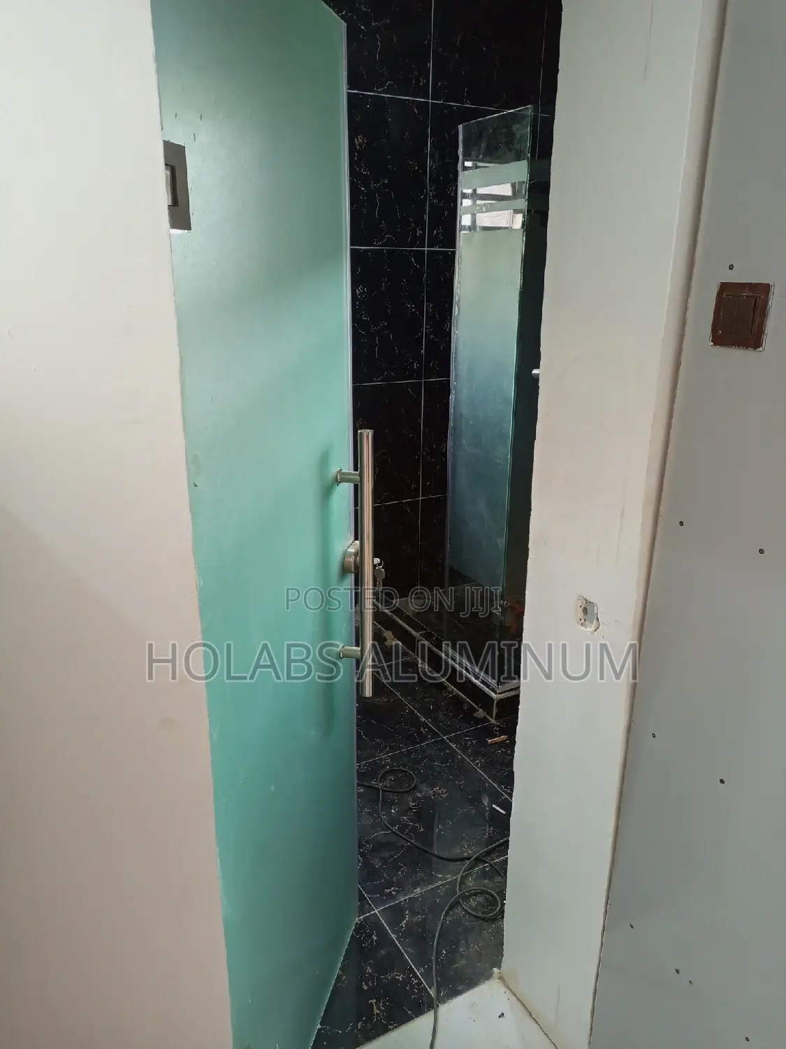 First Door Before Cubicle in Bathroom