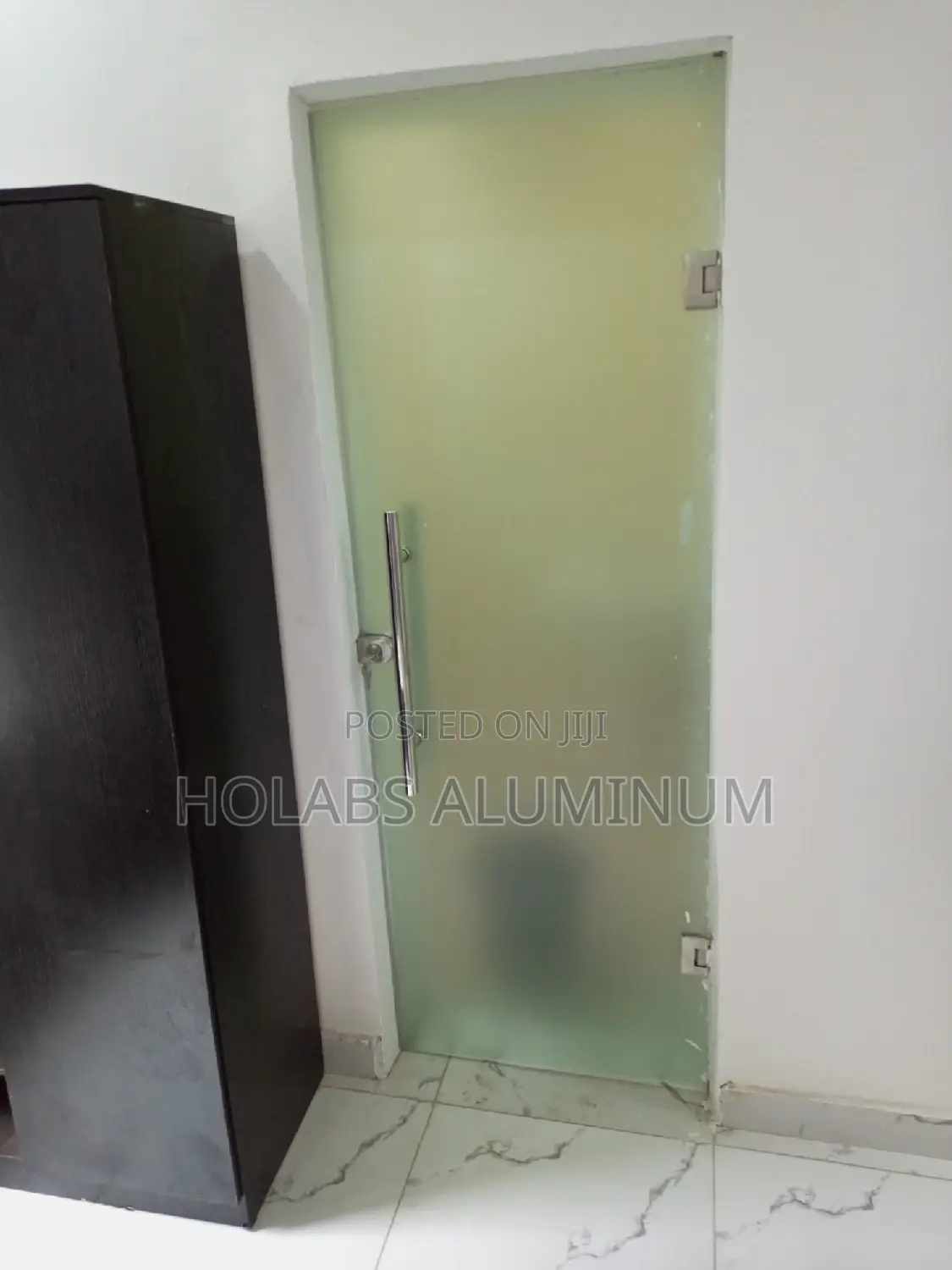First Door Before Cubicle in Bathroom