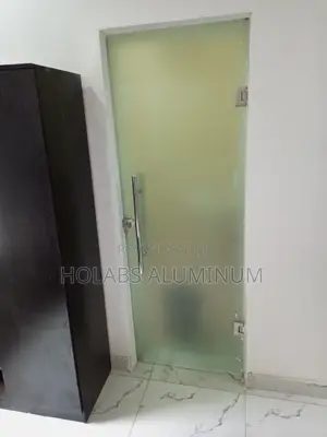 First Door Before Cubicle in Bathroom