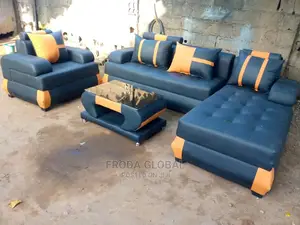 L-Shaped Sofa With Single Chair and Table. Leather Couch