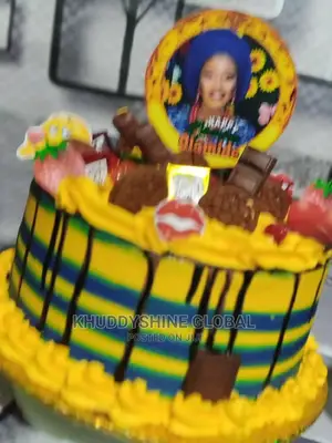 Yellow and Blue With Chocolates Topping Birthday Cakes