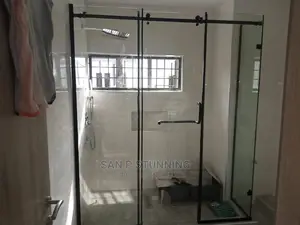 Tempered Glass Shower Cubicle With Black Accessories.