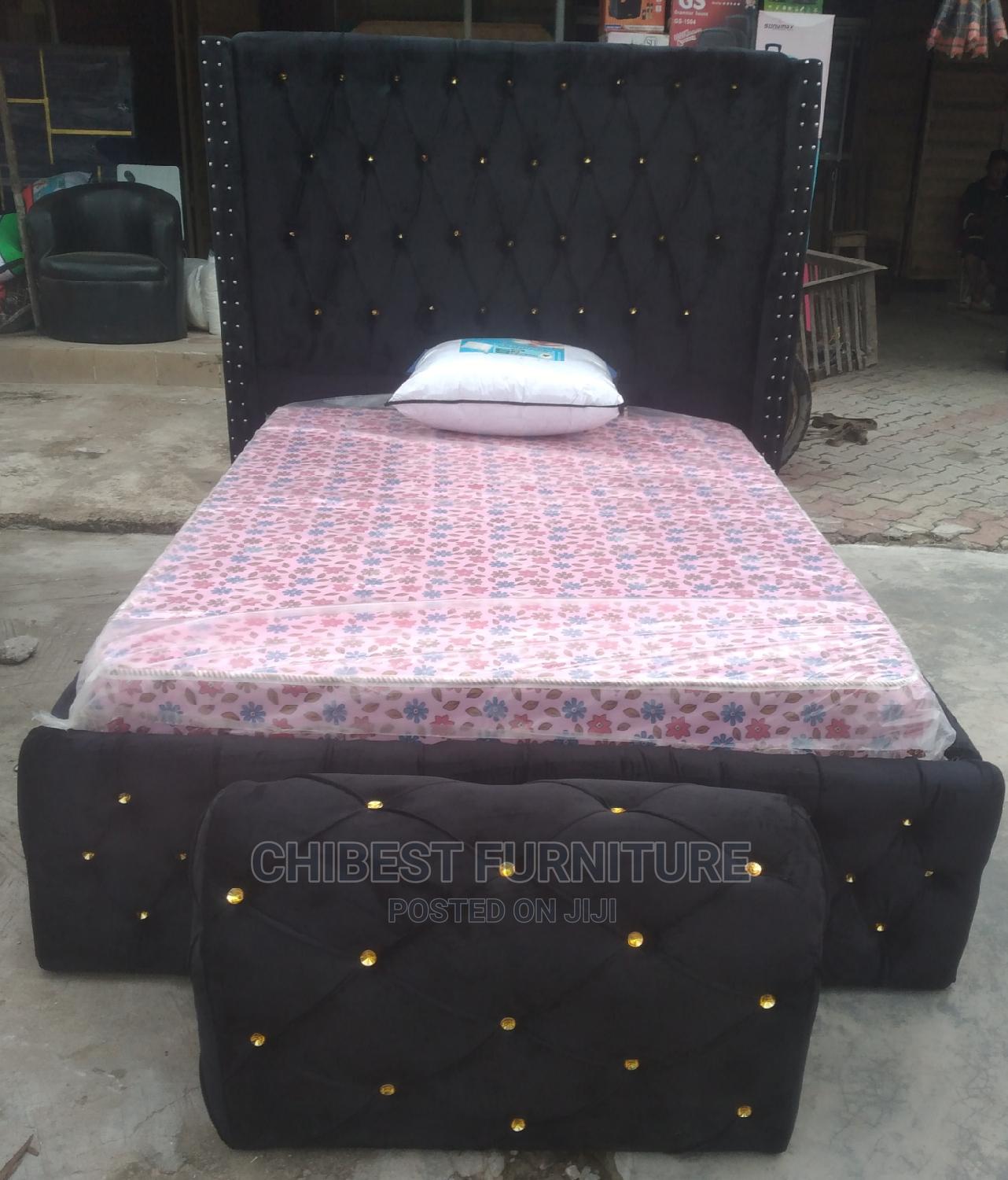 Quality 4.5by6 Upholstery Padded Bed Frame With One Ottoman.