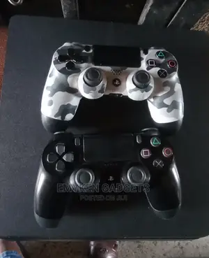 Photo - PS4 Slim Game Console With Extra Pad
