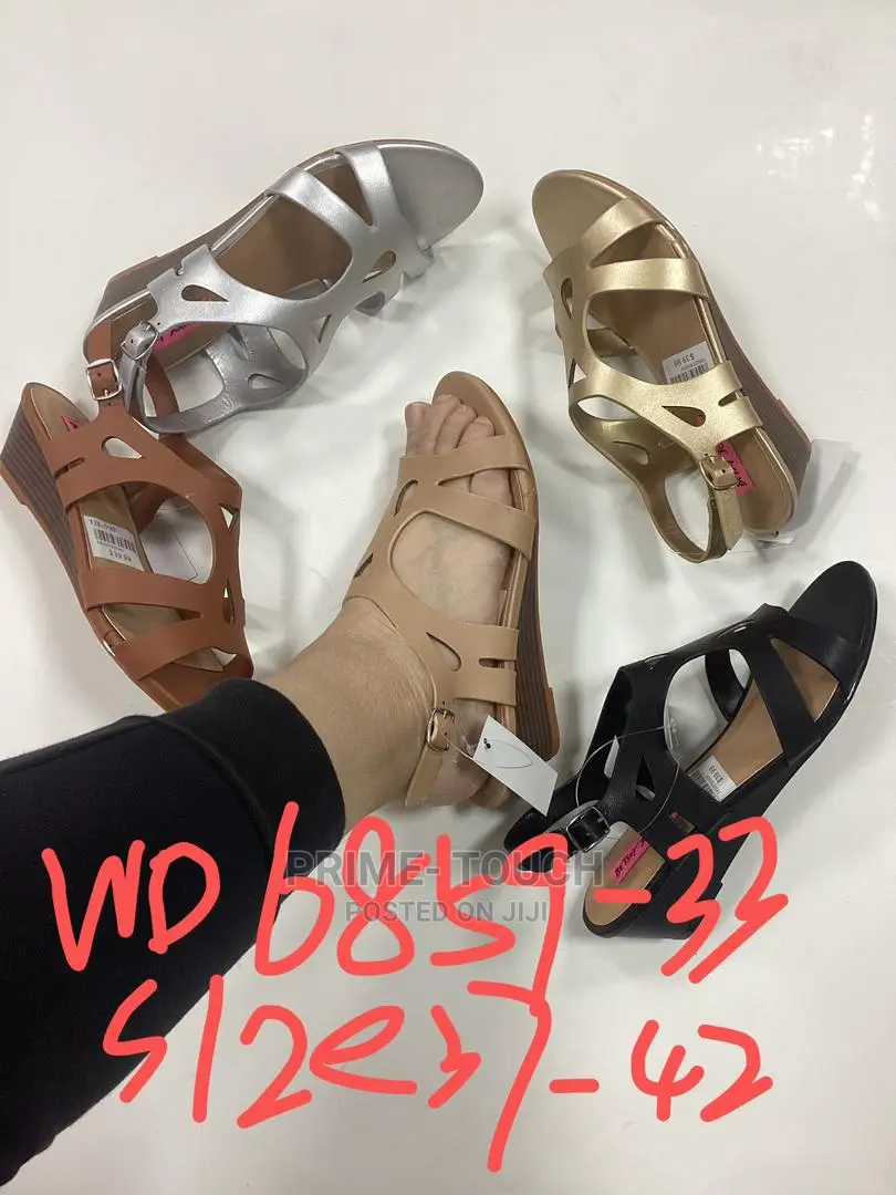 Low Wedge Slippers.