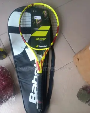 Photo - Babolat Yellow and Wine Racket Tennis