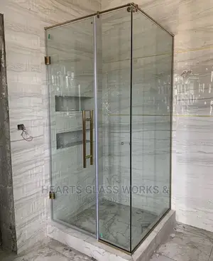 Shower Enclosure With Gold Accesories