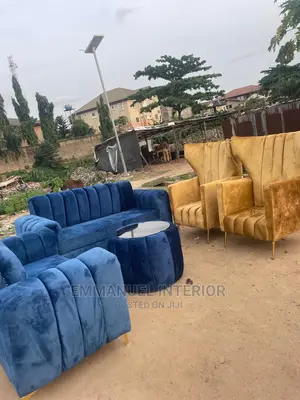 A Standard Living Room Sofa With Center Table