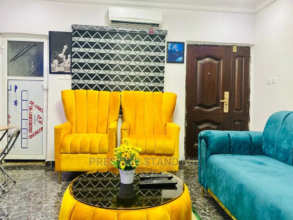 A Standard Living Room Sofa With Center Table