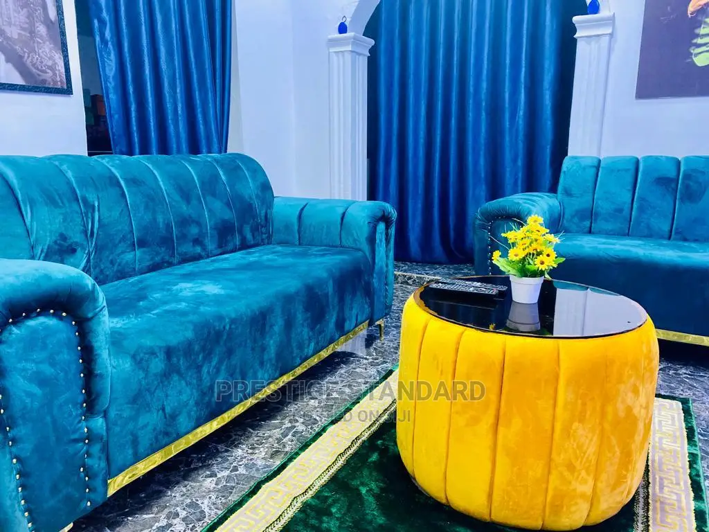 A Standard Living Room Sofa With Center Table