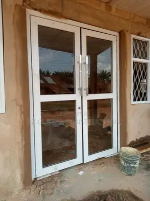 Photo - White Aluminum Double Panel Swing Door With Engine