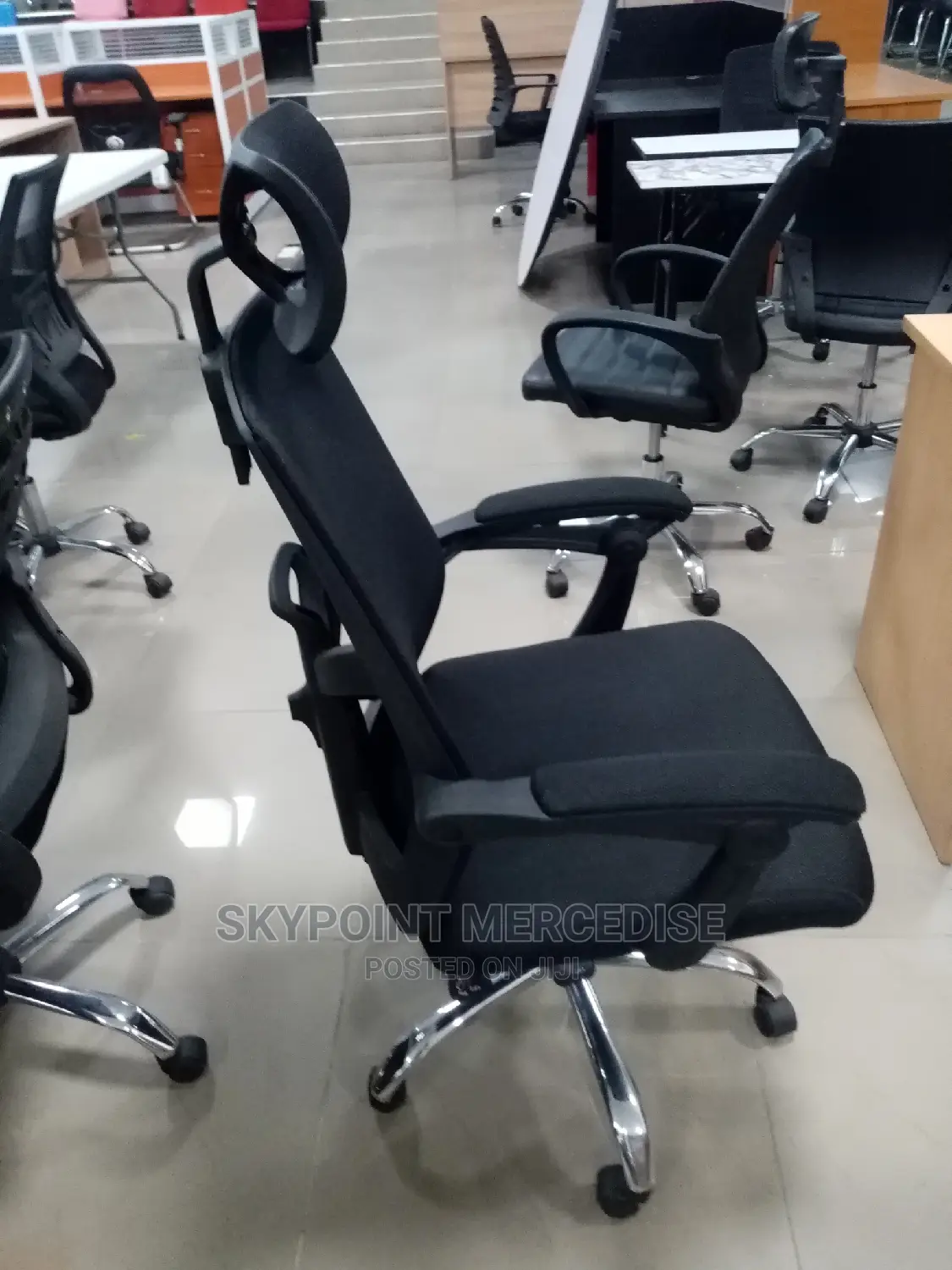 An Executive Office Swivel Chair With Headrest