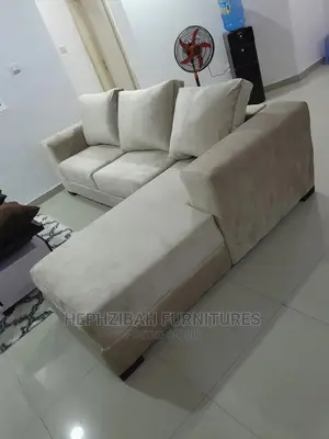 L Shaped Sofa With Back Pillows