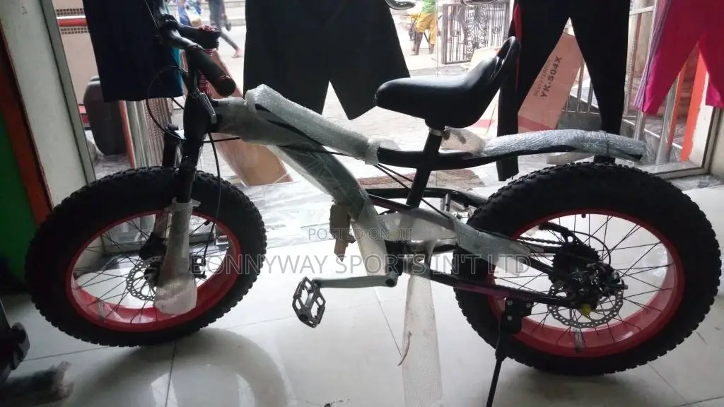 Children Big Tires Riding Bicycle