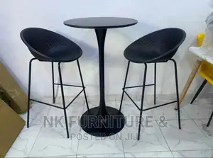 A Set of Bar Stools and Table
