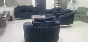 A Curvy 3,2,1 Sofa Set With A Fabric Finish + Center Table.