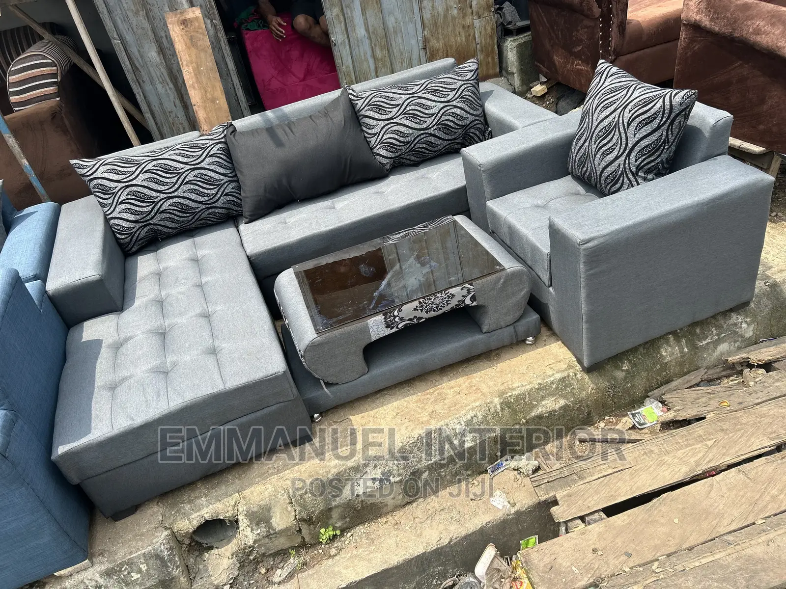 A Standard Grey Sofa With Center Table
