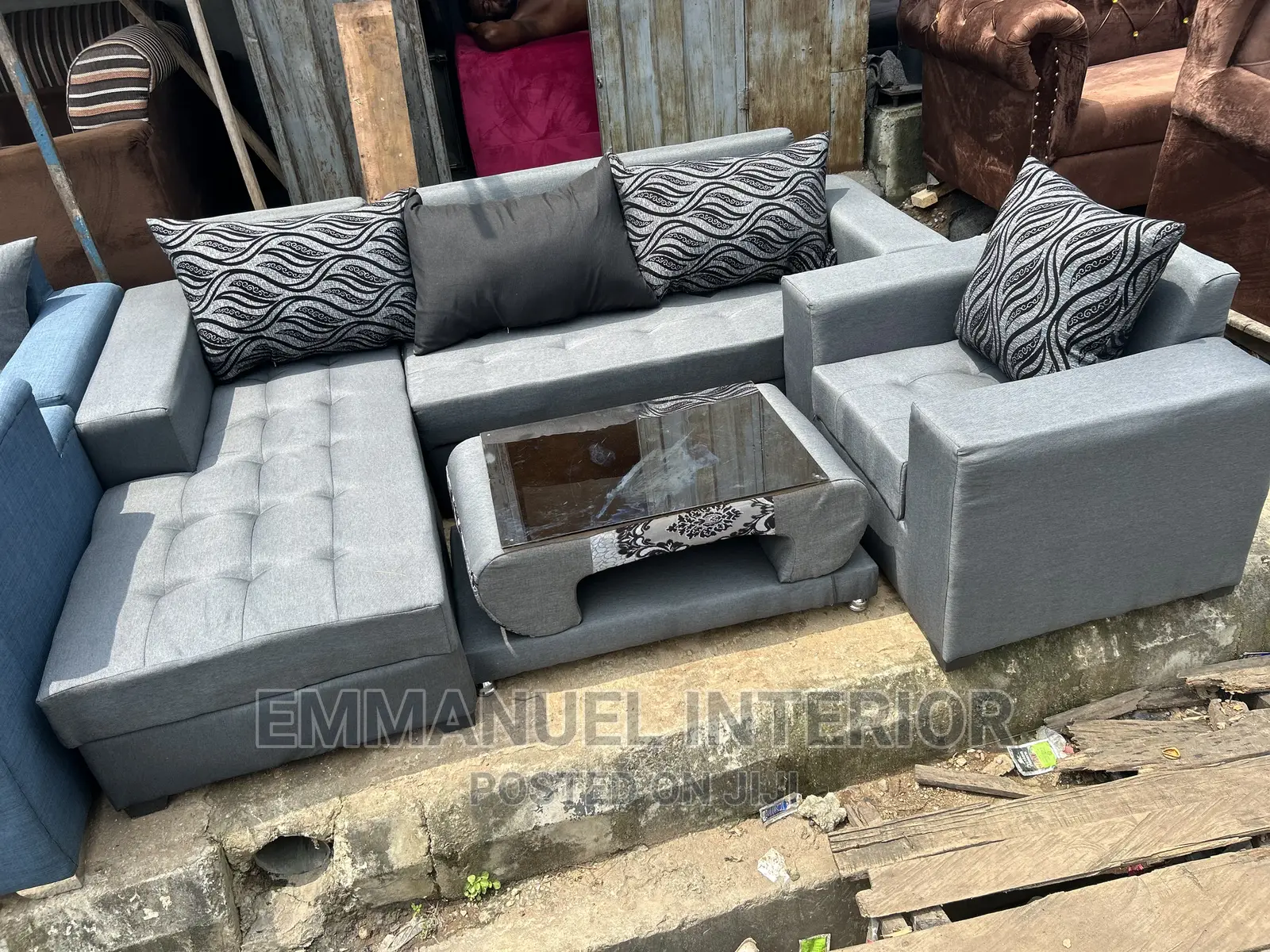 A Standard Grey Sofa With Center Table