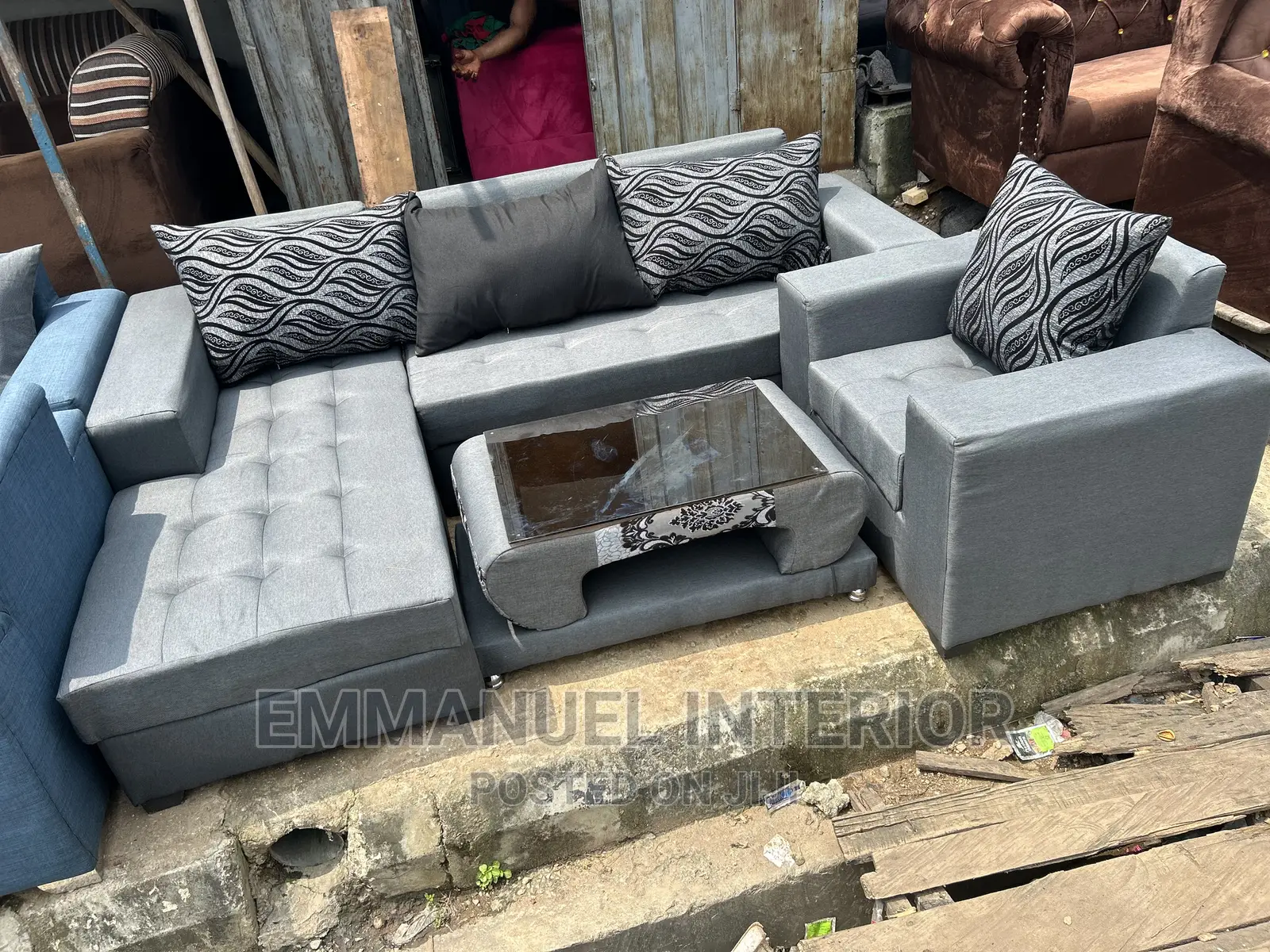 A Standard Grey Sofa With Center Table