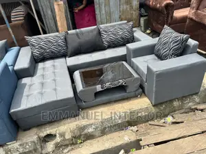 A Standard Grey Sofa With Center Table