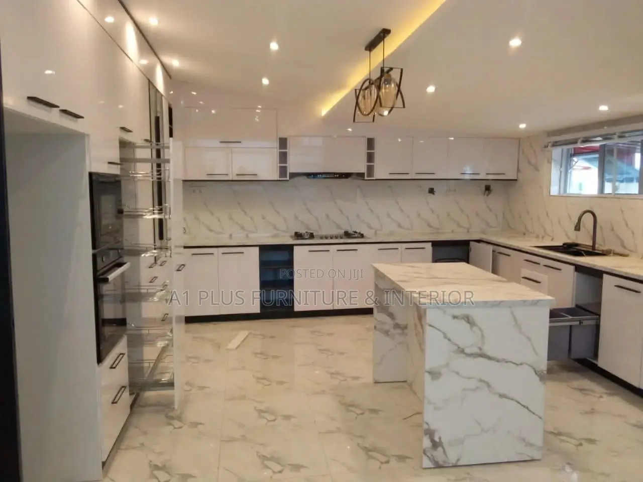 U-shaped Kitchen In A Sleek Black And White Design