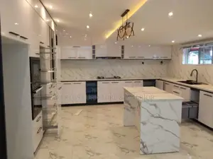 U-shaped Kitchen In A Sleek Black And White Design