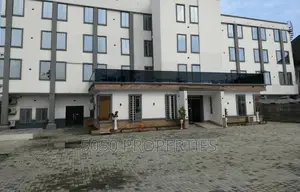 A 4 Story Building Hotel With Rooftop