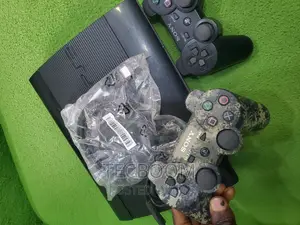Sony [ Ps3 ] With 2 Pads + 20 Games