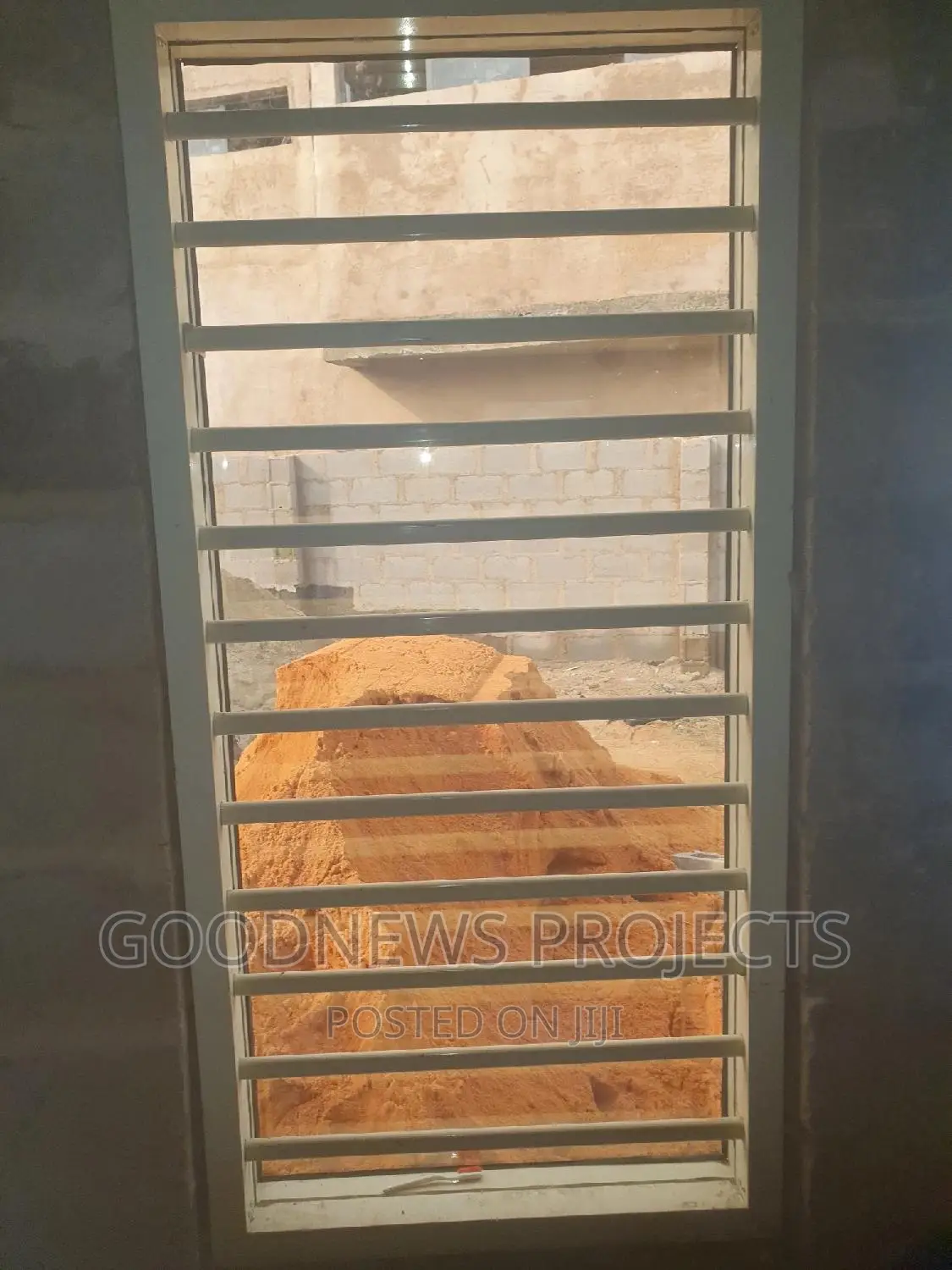 Cream Frameless Window With Burglary