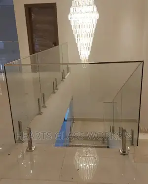 Frameless Glass Railing - Spigot Stand Silver Top Rail