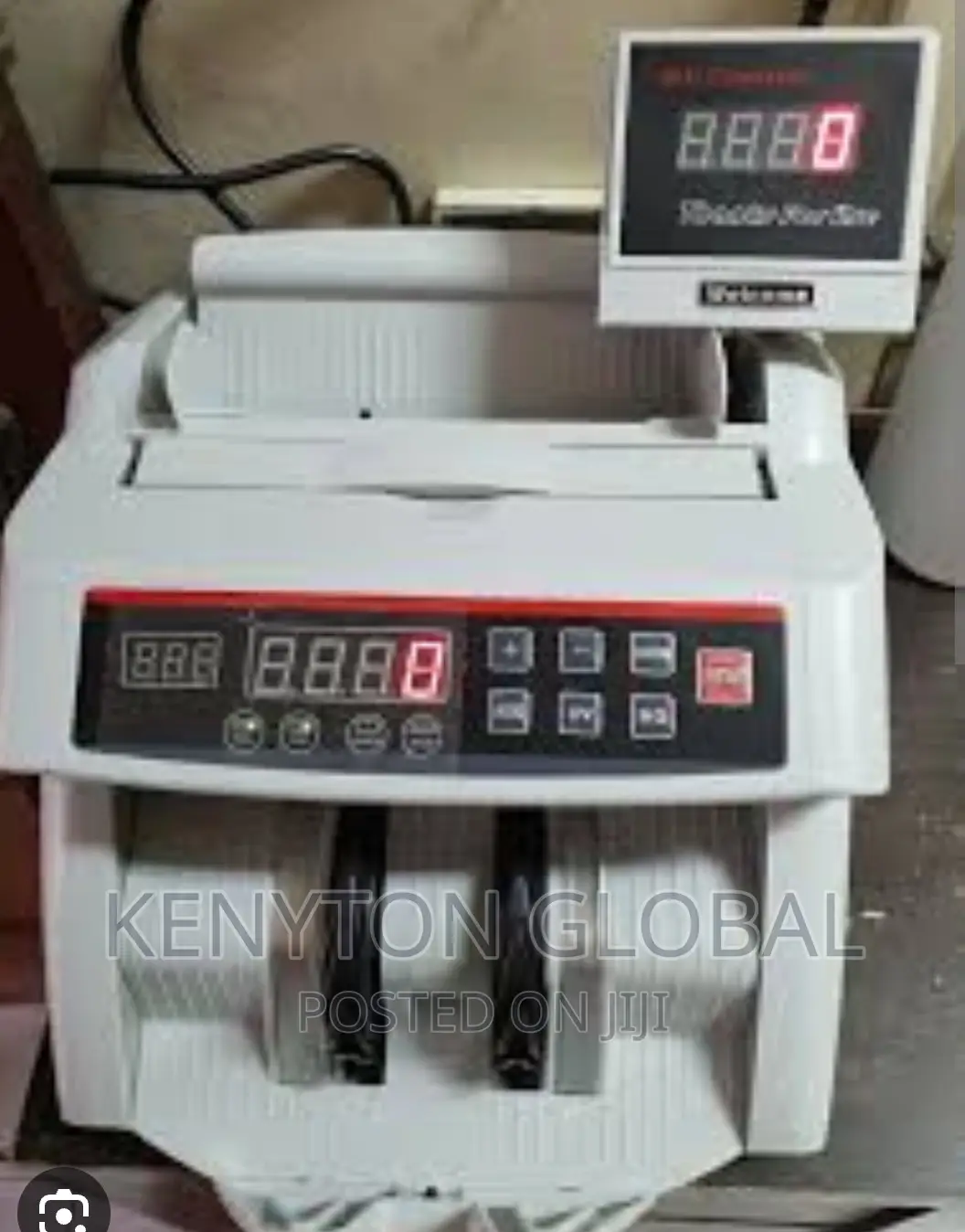 Counting Machine With Automatic Counterfeit Detector