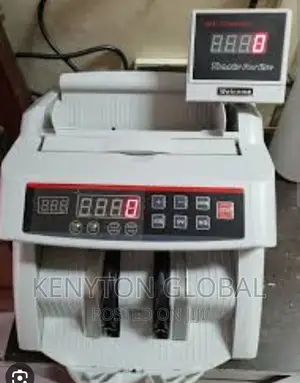 Counting Machine With Automatic Counterfeit Detector