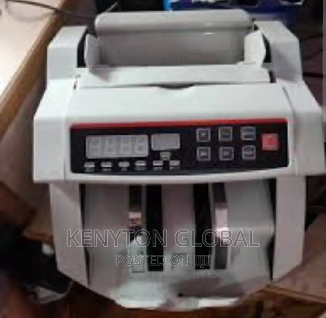 Counting Machine With Automatic Counterfeit Detector