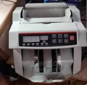 Counting Machine With Automatic Counterfeit Detector