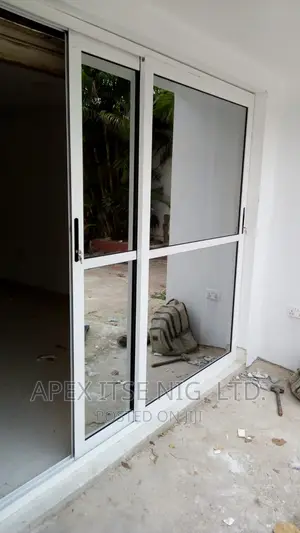 Dual Sliding Alum/Glass Door.