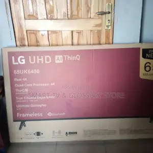 65inches LG Smart TV With Building Showcasing Apps