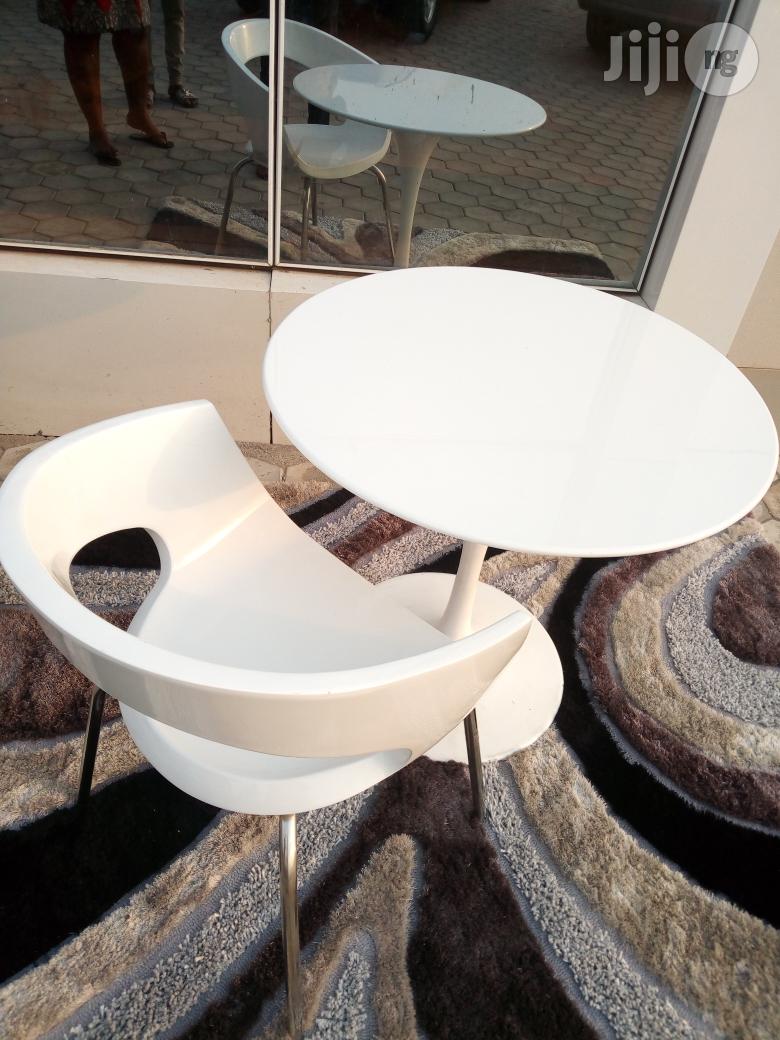 A White Discusion Table With Chair